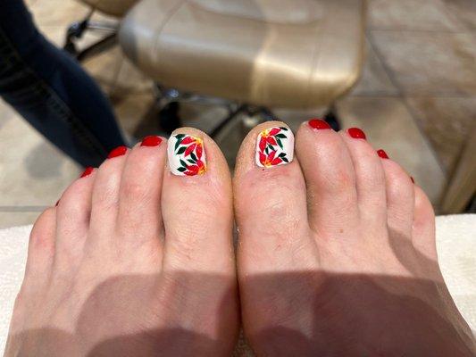 Christmas pedicure, with poinsettias on my big toe nails. So pretty!