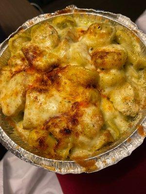 Tortellini with chicken comes with a side salad and garlic bread.