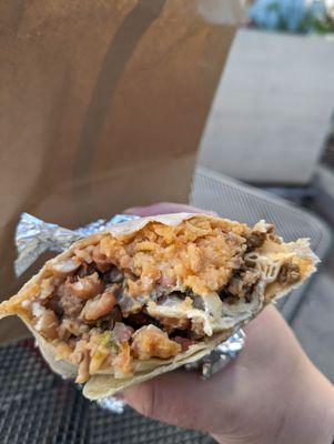 Steak super burrito with fried beans