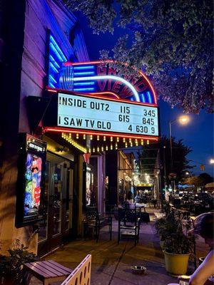 The retro sign lights up the patio well into the night.