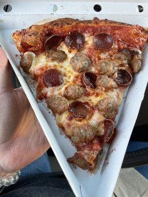 Slice of spicy pepperoni and sausage, tasty & generous size