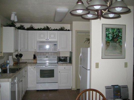 Original counters, Granny's ho-hum 50'S kitchen with 4 X 4 tiles and grout you never get clean.