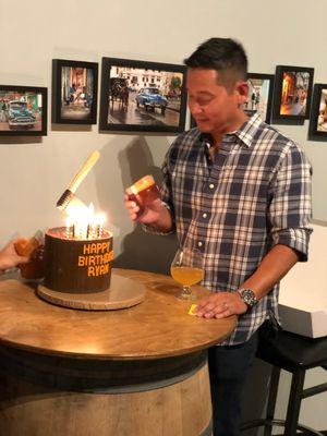 Axe Throwing birthday party Cake with a sugar Old Fashion drink on the side.