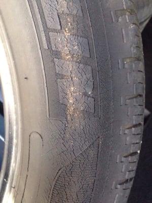 Dry rot that is on 100% of the sidewall of the rear tire that caused it to lose and not retain air pressure.