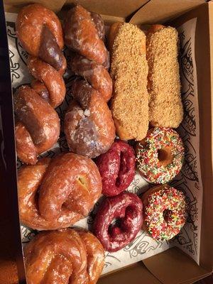 Vanilla and chocolate tiger tails, bottom left is salted caramel pretzel upper right is caramel iced with peanut, red velvet