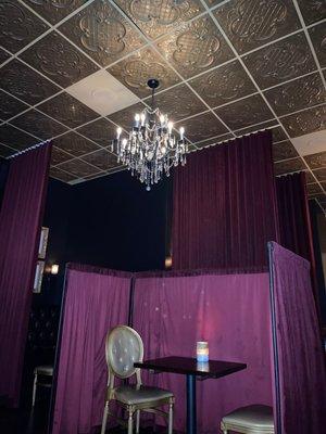 Interior decor...velvet curtains, mood lighting, fancy chandelier.