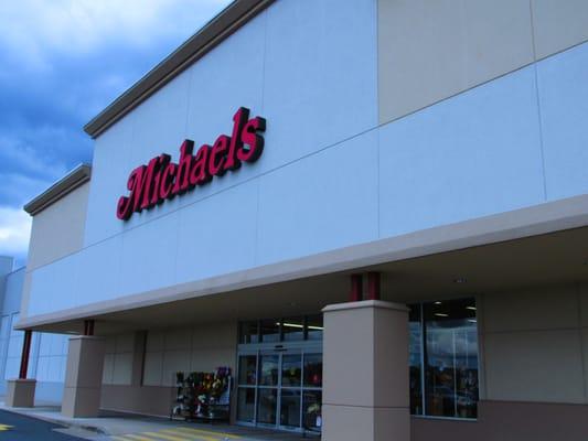 sign outside the store which is in the back lot of the shops complex