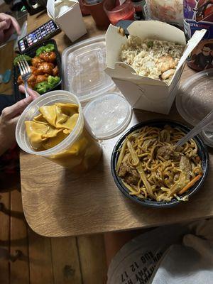 Orange colored wonton soup, lomein, chicken, shrimp fried rice.