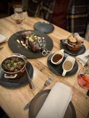 Ribeye steak dinner with French side dishes