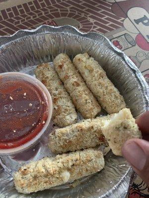 Uncooked mozzarella sticks