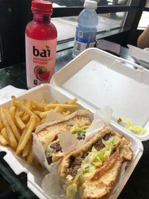 Cheese burger with tomato, lettuce and fries