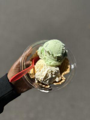 Pistacho and scotchy pecan ice cream in a waffle bowel.