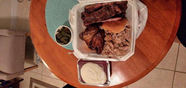 Good portion size this is the 3 meat plate: ribs, pulled pork, and chicken wings. With small collard greens and red velvet cake.