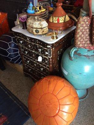 Inlaid side table, pouf, and vase