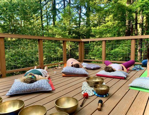 AirBnb backyard set up off beautiful deck amongst the trees