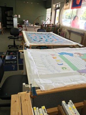 two large quilt racks, works in progress