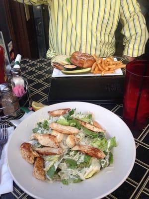 Chicken Caesar salad and Cheese Burger on a Pretzel Bun