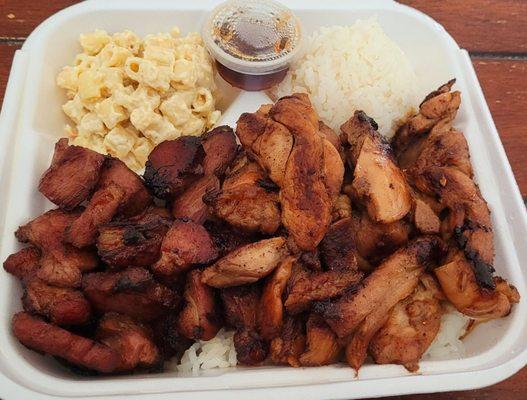 Chicken and smoked meat ( pork? beef?idk) plate lunch. Rice piled under meats too.