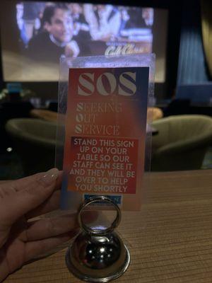 SOS sign for the table when you need service during a movie!