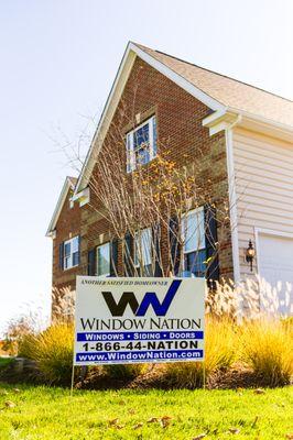 Window Nation sign out front of recent project