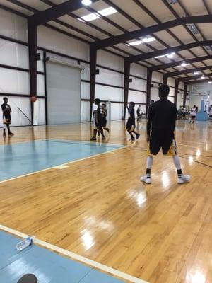 Houston Hornets warming up on a slippery floor. }:{