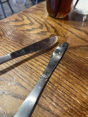 Dirty silverware. Photo doesn't do it justice, both sides were gross. Servers roll silverware here in napkins and rolled dirty silverware.