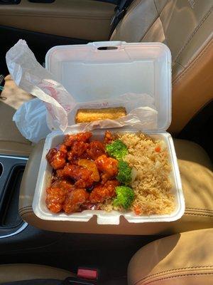 Orange Chicken with fried rice and egg roll.