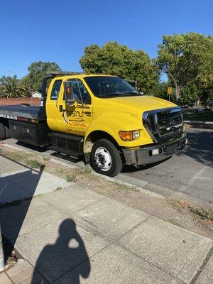 Here's a picture of their tow truck not towing my car.