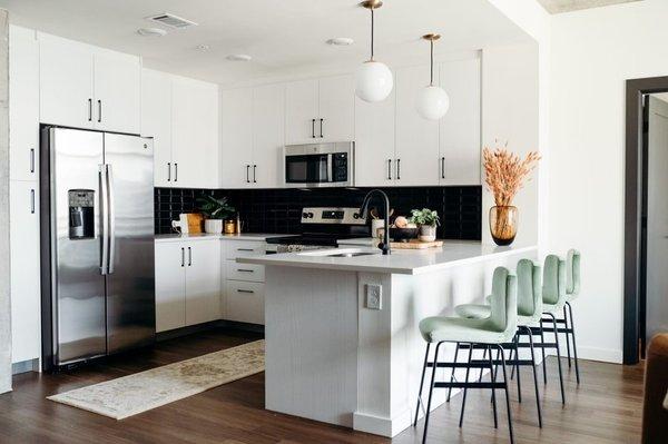 Kitchen remodel with sage green bar stools