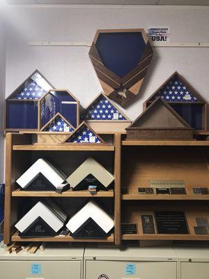 We sell quality solid wood flag and shadow boxes made here locally. Each box comes with a personalized plate.