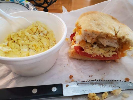 Scrambled eggs and the remaining half of my Cheese Chicken Biscuit (with added tomato).