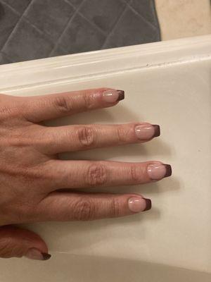 Burgundy twist on a French manicure.