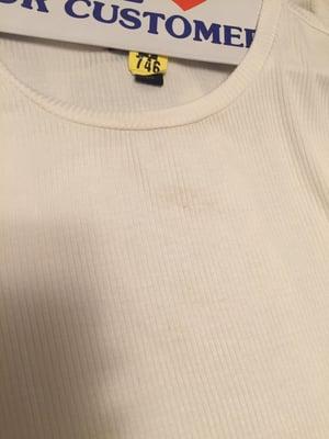 Stain still on collar and front of shirt. Hanger phrase "we love our customer" is a joke