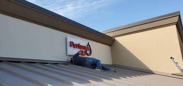 Exterior Building Illuminated Sign: Aluminum reversed channel letters w/ halo back lighting, installed Allen Premium Outlets Allen, TX