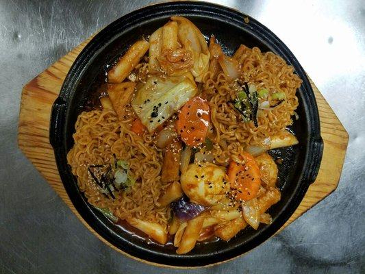 Tteokbokki is rice cake dish seasoned with some spices and  a fish cake, some noodle......