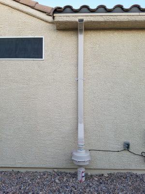 Close up of Radon mitigation system. The bulge at the bottom of the wall is the insulated fan system.