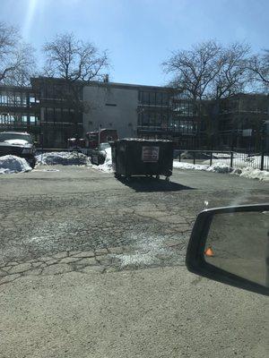 Garbage cans sitting in the middle of our parking lot for days.