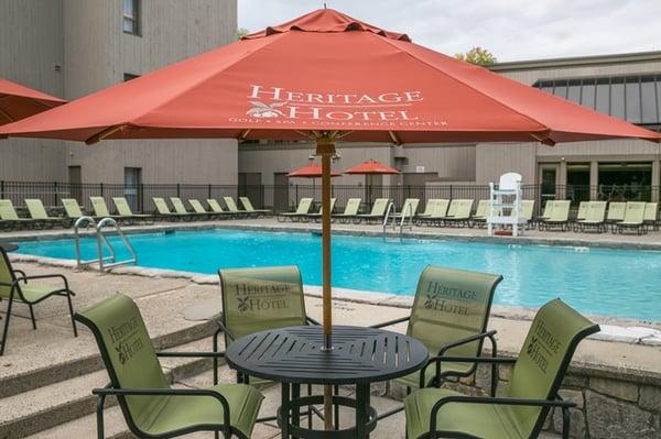 The outdoor pool area has comfortable seating and a pool bar