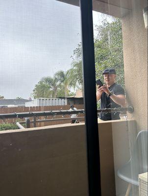 This was a random man taking pictures from our balcony. The front desk had no idea who he was, and he tried to tell me he was an "engineer."