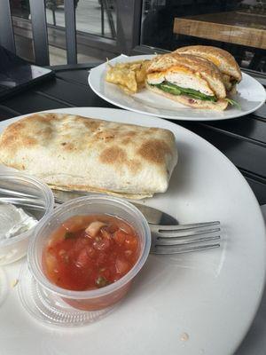 Breakfast Burrito and Chipotle Artichoke Sandwich with complimentary chips on the side