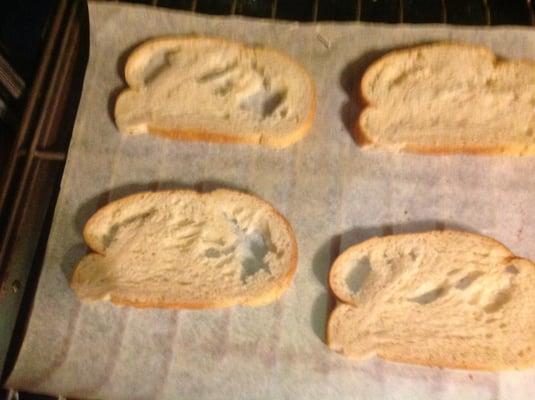 No, mice didn't get to the loaf-this is how it came.  I wanted to melt cheese on these slices.  You can imagine how well that went!