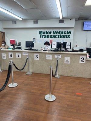 A worker counting money while the off us wait to be waited on at 5:20pm.