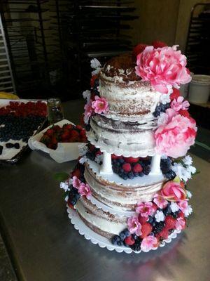 Naked cake with fruit and flowers