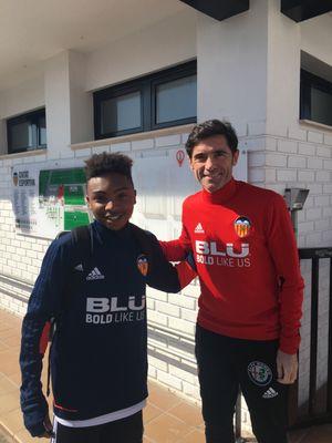 Our owner Antonio Lee during his time playing with Valencia Academy posing with ex Valencia coach Marcelino Garcia