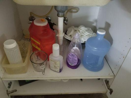 Under the sink in the facial room, and the bowl of used sponges in the back because they like to reuse sponges