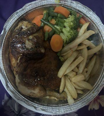 Roasted Chicken with fries and steamed vegetables.