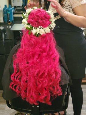 A photo of my long pink curled hair with a white flower crown; this was still at my appointment and wasn't quite done yet