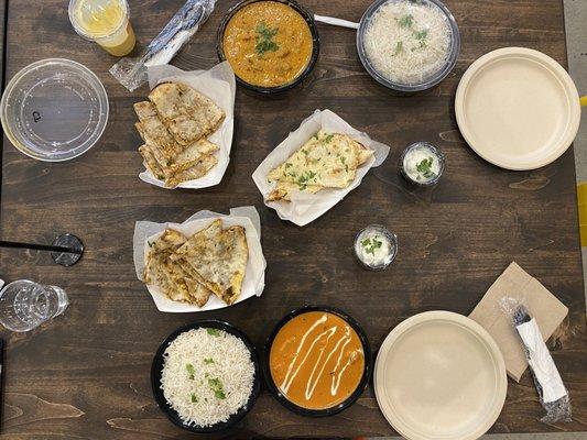 Butter Chicken, Chicken Tikka Masala, lamb naan, and garlic naan