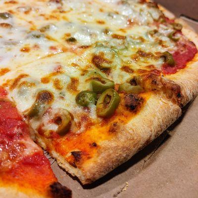 Close-up of thin-crust pizza: decent toppings, average crust