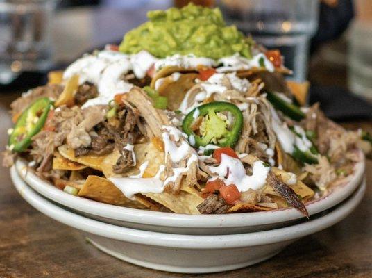 Carnitas and carne asada nachos. Good. GINORMOUS!